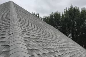 Weatherwood is a common color on residential houses. This is a ridge with weatherwood three tab shingles